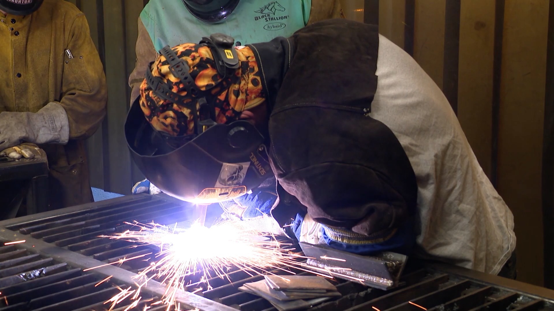 Welding program students working on a project